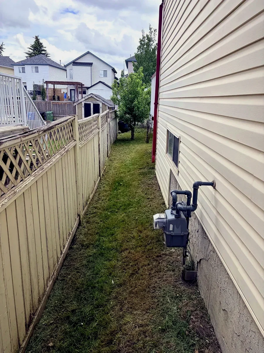Same Calgary side yard cut clean and tidy by Edge Property Services