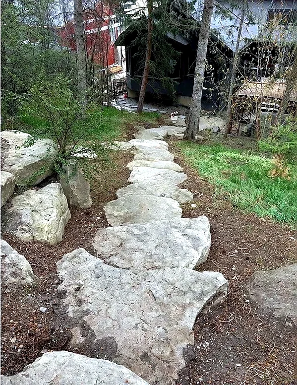 Stone path cleared, weeded and defined by Edge Property Services; Calgary